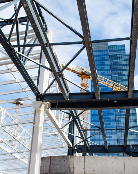 construction-site-with-steel-frame-structure-and-c-2024-10-18-08-31-20-utc-scaled.jpg