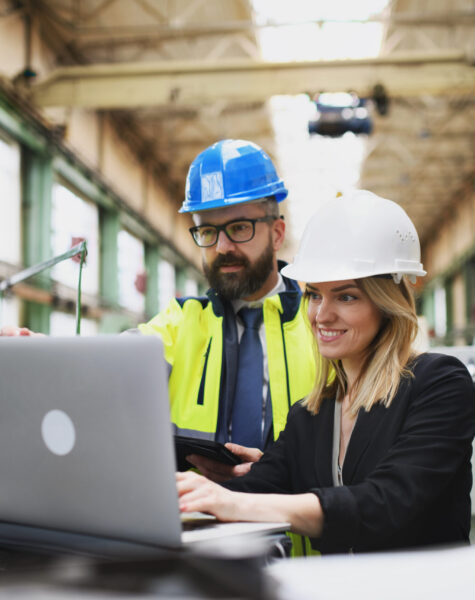 male-and-female-industrial-engineers-discussing-fa-2024-10-18-08-33-49-utc-scaled.jpg